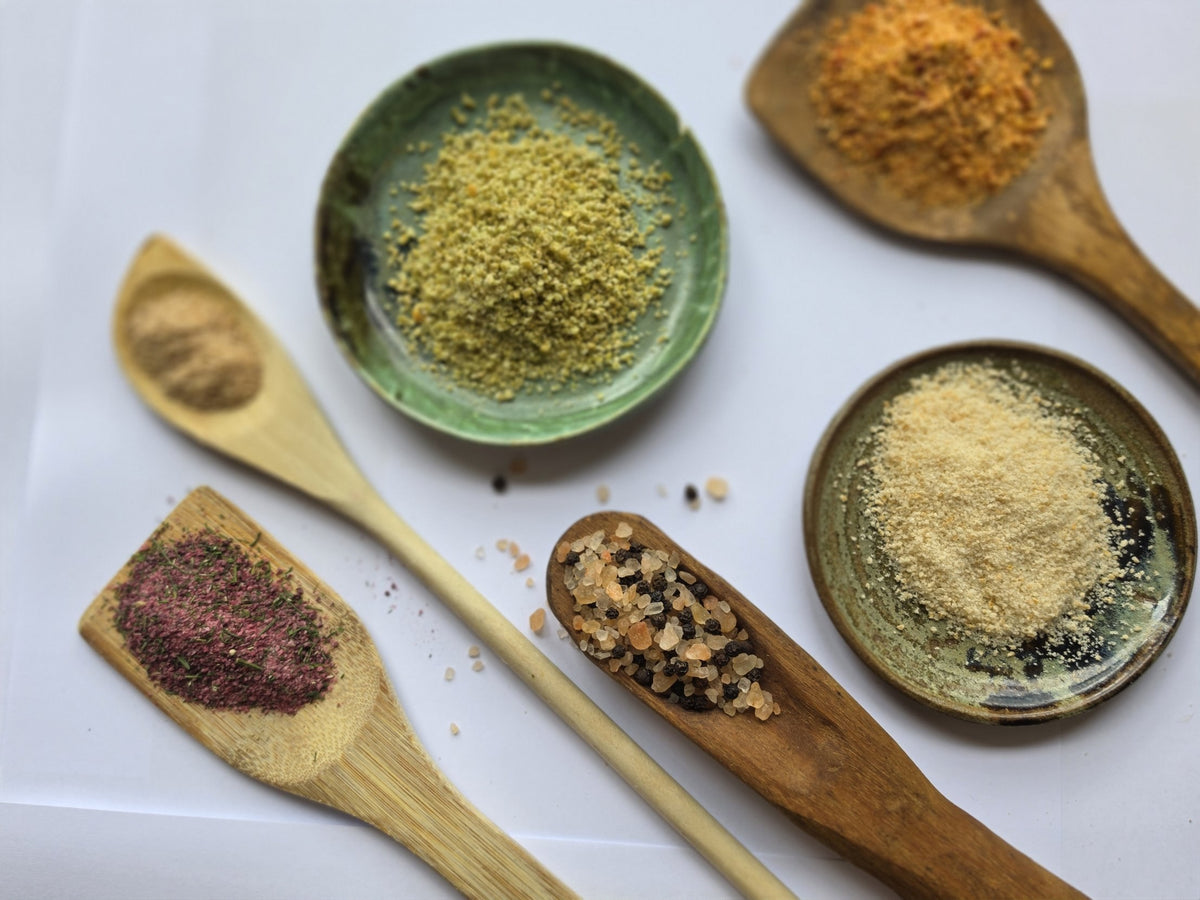 Our flavoured salts on wooden spoons and handmade dishes